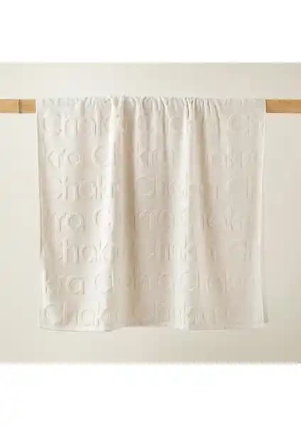 Chakra Logolu Ekru Plaj Havlusu Şık ve Konforlu Tatil Aksesuarı